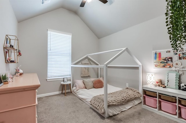 carpeted bedroom featuring multiple windows, ceiling fan, and vaulted ceiling