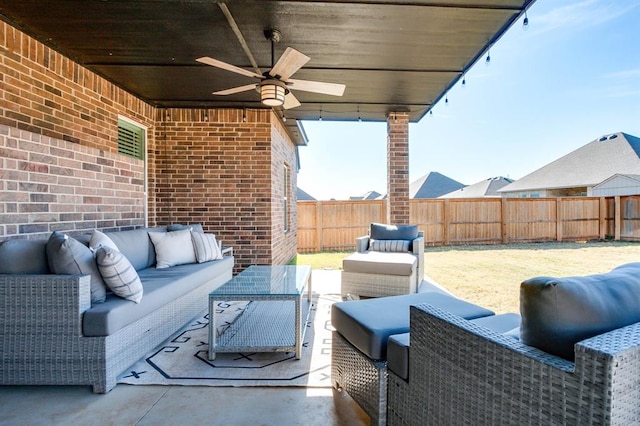 view of patio with outdoor lounge area and ceiling fan