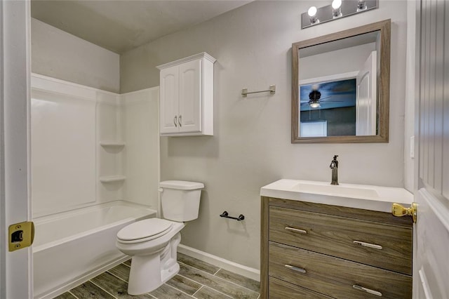 full bathroom featuring shower / bathing tub combination, wood-type flooring, vanity, and toilet