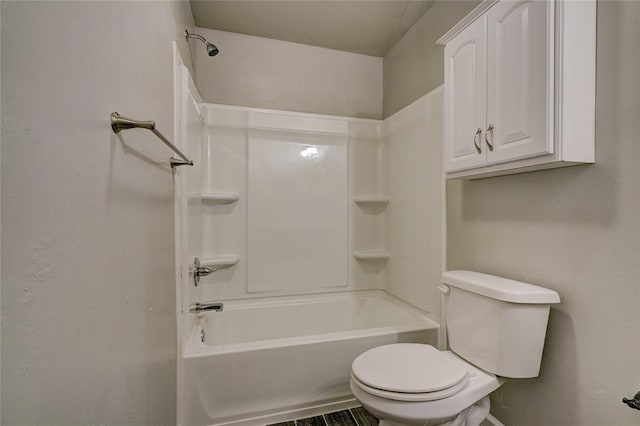 bathroom with toilet and bathtub / shower combination