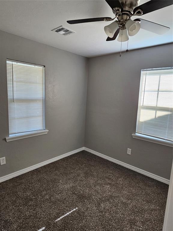 spare room with carpet flooring and ceiling fan