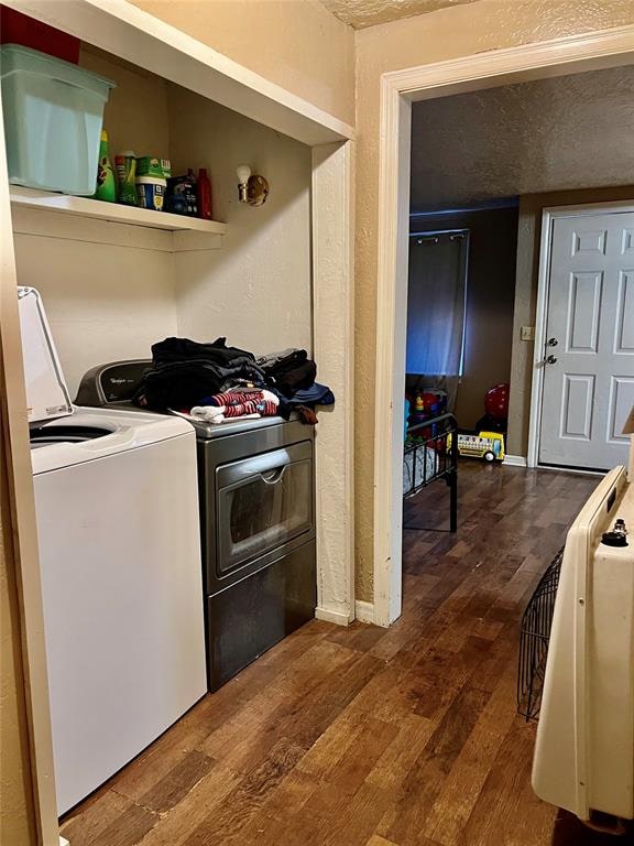 interior space featuring hardwood / wood-style flooring and washing machine and clothes dryer