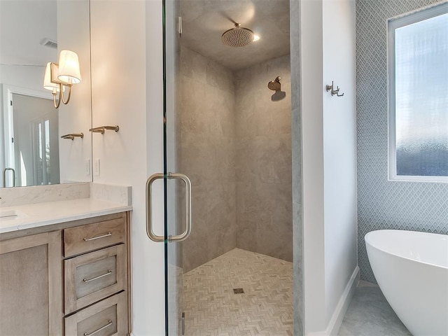 bathroom featuring vanity and plus walk in shower