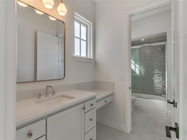 full bathroom with toilet, vanity, and shower / bath combination with glass door