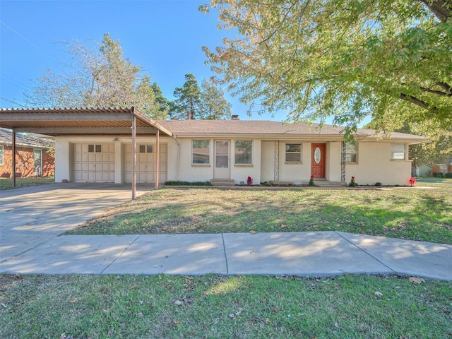 ranch-style home featuring a garage and a front yard