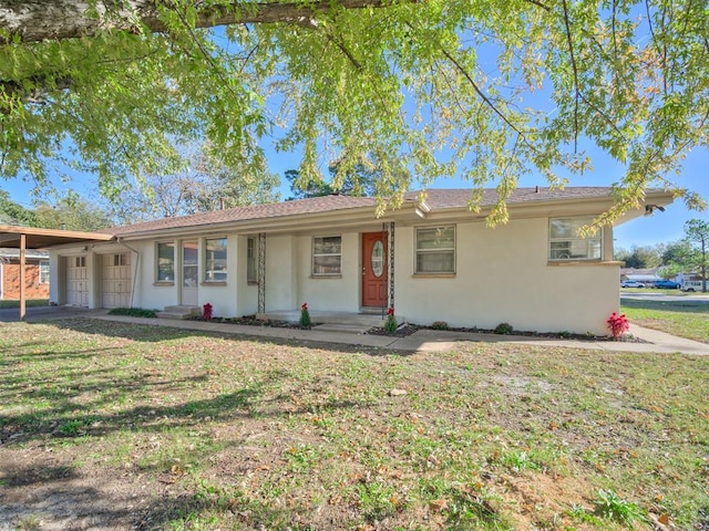 ranch-style house with a front lawn and a carport