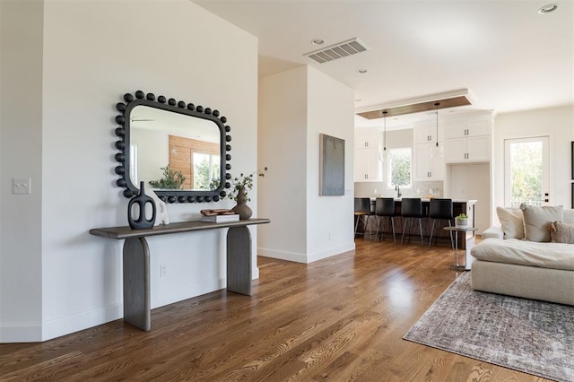 living room with dark hardwood / wood-style floors