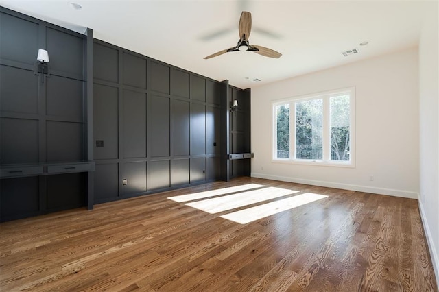 unfurnished bedroom featuring hardwood / wood-style flooring and ceiling fan