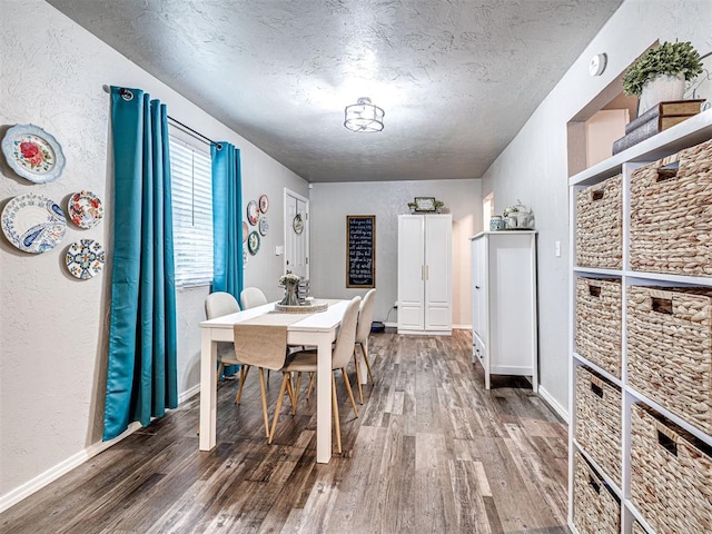 dining area featuring hardwood / wood-style floors and a textured ceiling