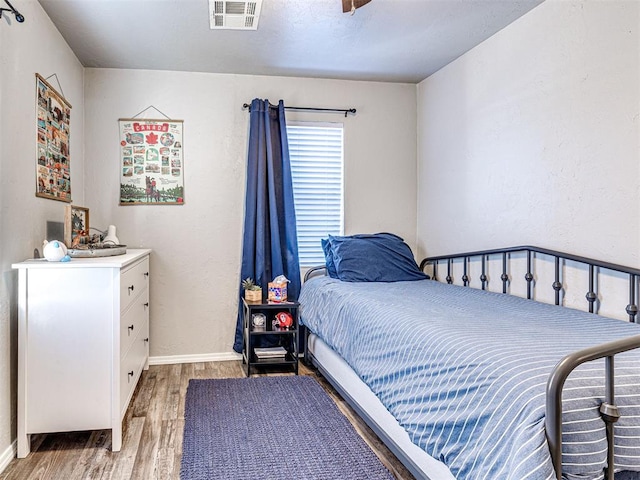 bedroom with wood-type flooring