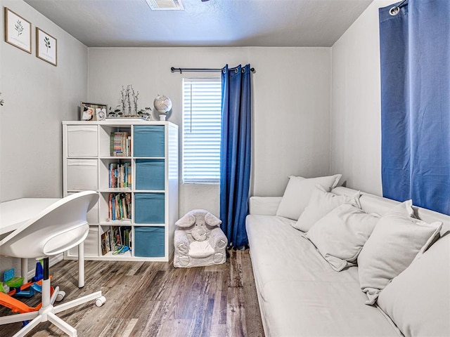 bedroom with hardwood / wood-style flooring