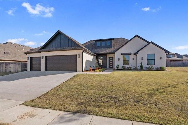 modern farmhouse style home featuring a garage, concrete driveway, fence, a front lawn, and board and batten siding