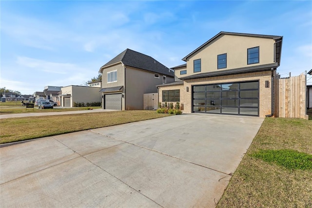 view of front of home featuring a garage and a front yard