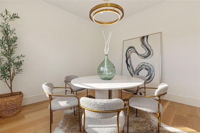 dining space featuring light hardwood / wood-style floors