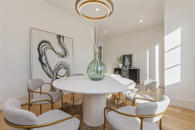 dining room with light hardwood / wood-style floors