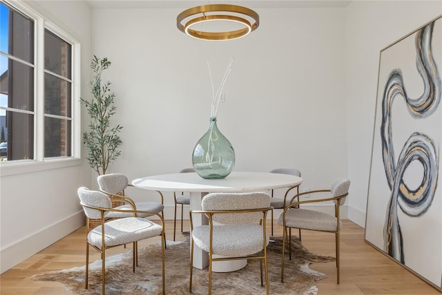 dining area with light hardwood / wood-style floors