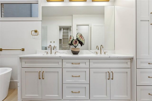 bathroom featuring a bathing tub and vanity