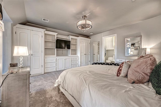 carpeted bedroom with lofted ceiling