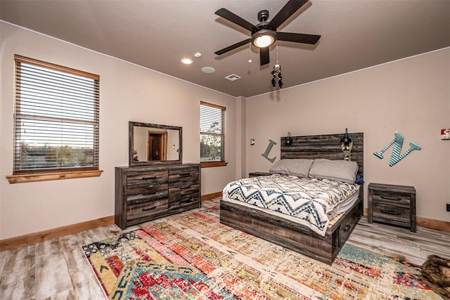 bedroom featuring hardwood / wood-style floors and ceiling fan