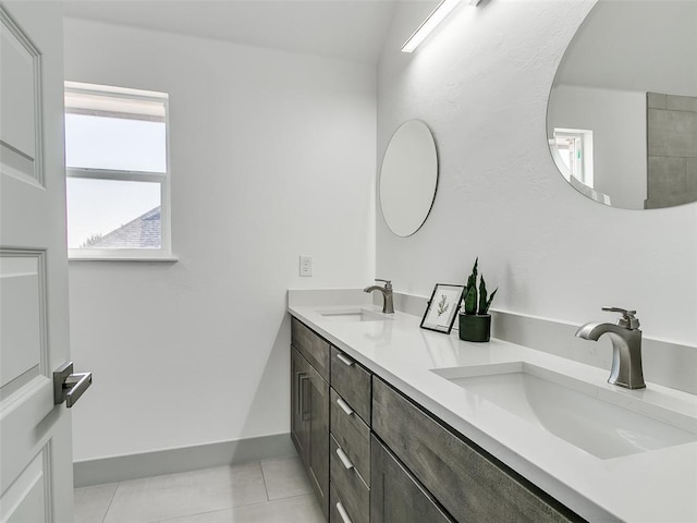 bathroom with tile patterned flooring and vanity