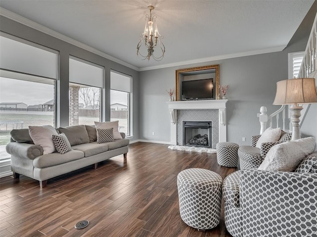 living room with ornamental molding, wood-type flooring, and a wealth of natural light