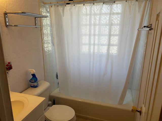 full bathroom featuring plenty of natural light, toilet, vanity, and shower / tub combo