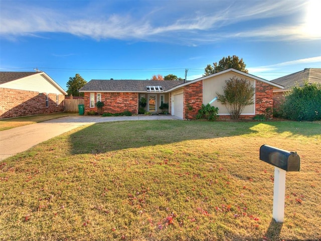 view of front of property with a garage, brick siding, driveway, and a front lawn