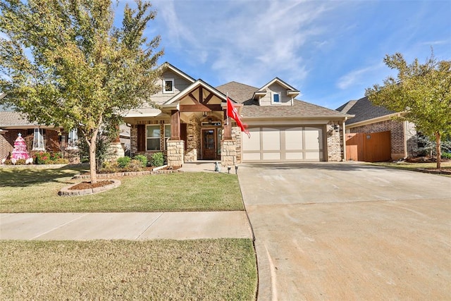 view of front of home with a garage and a front yard