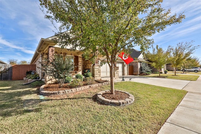 view of front of home with a garage and a front yard