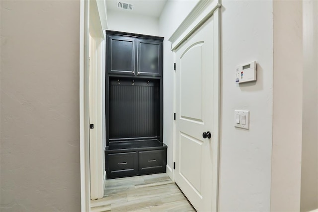 mudroom with light hardwood / wood-style floors