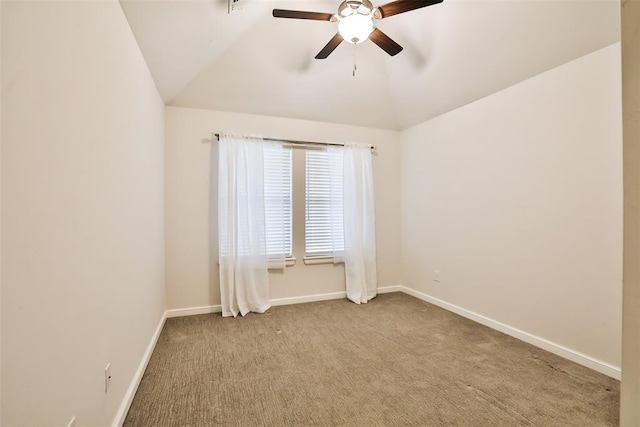 unfurnished room featuring vaulted ceiling, light colored carpet, and ceiling fan