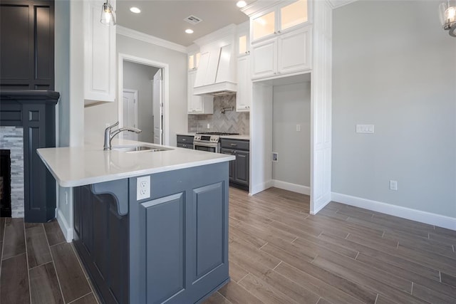 kitchen featuring white cabinets, pendant lighting, dark hardwood / wood-style floors, and sink