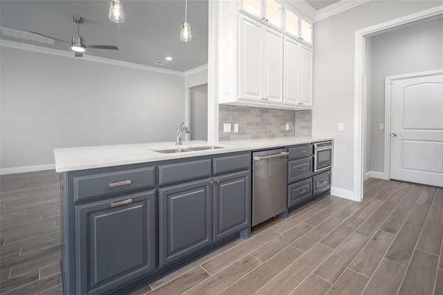 kitchen with sink, white cabinets, stainless steel appliances, and dark hardwood / wood-style floors