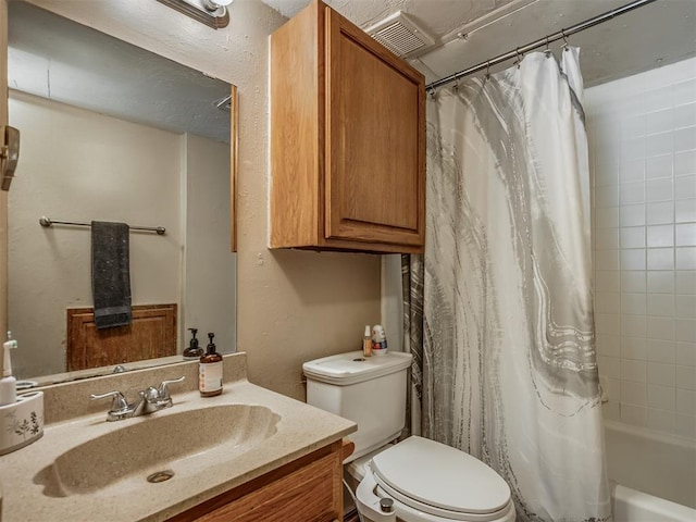 full bathroom with shower / tub combo, vanity, and toilet