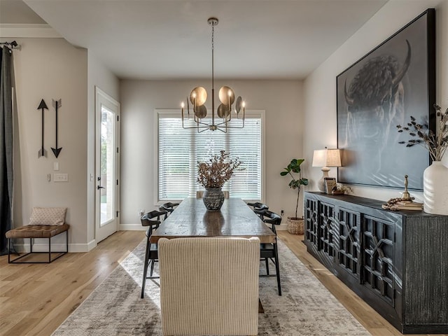 dining room featuring a chandelier and light wood-type flooring