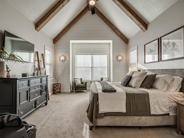 bedroom featuring high vaulted ceiling, wood walls, and carpet flooring