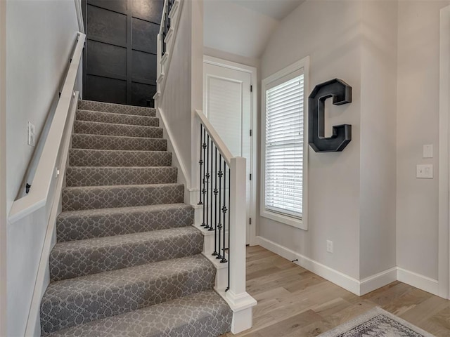 stairs with hardwood / wood-style flooring