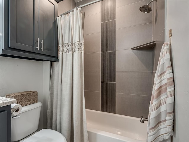 full bathroom featuring toilet, shower / bath combination with curtain, and vanity