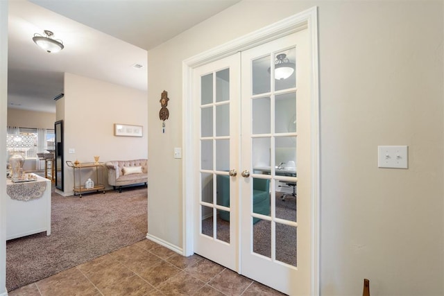 doorway with carpet flooring and french doors