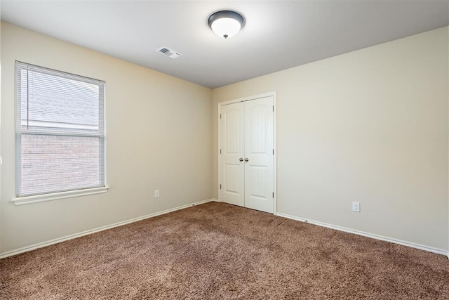 spare room featuring carpet flooring