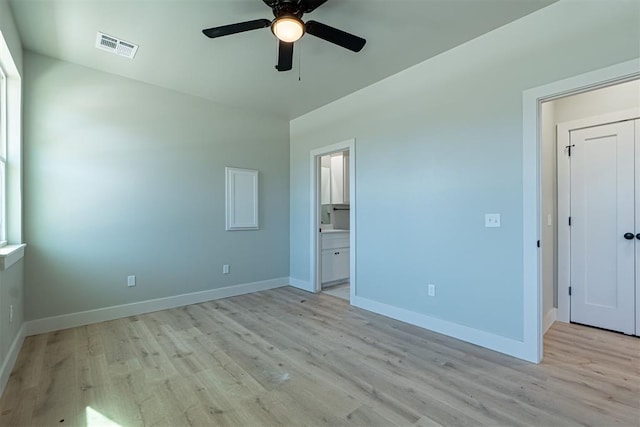 unfurnished bedroom with ceiling fan, light hardwood / wood-style flooring, and ensuite bath