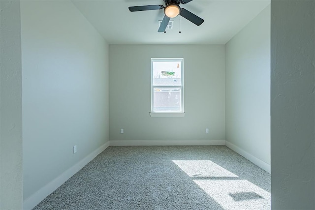 empty room featuring carpet flooring and ceiling fan