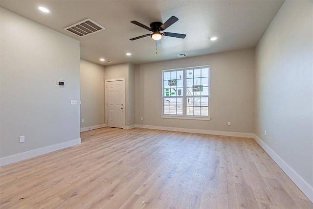 spare room featuring ceiling fan and light hardwood / wood-style floors