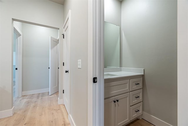 bathroom featuring vanity and hardwood / wood-style floors