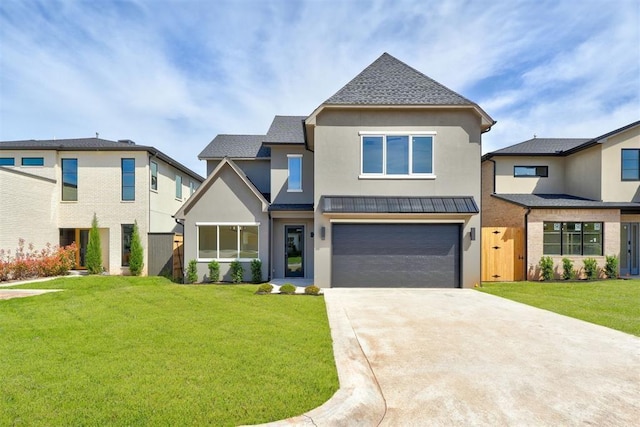 view of front of home with a garage and a front lawn