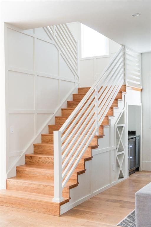 stairs featuring wood-type flooring