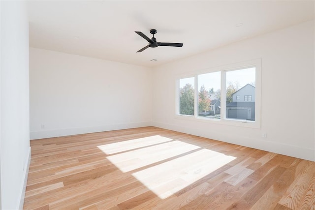 spare room with ceiling fan and light hardwood / wood-style floors