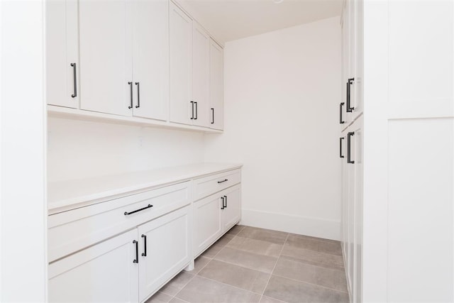 washroom with light tile patterned floors