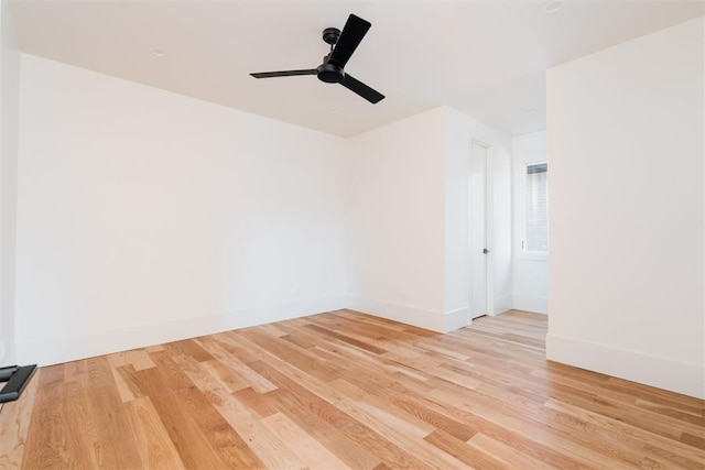 empty room with light hardwood / wood-style floors and ceiling fan