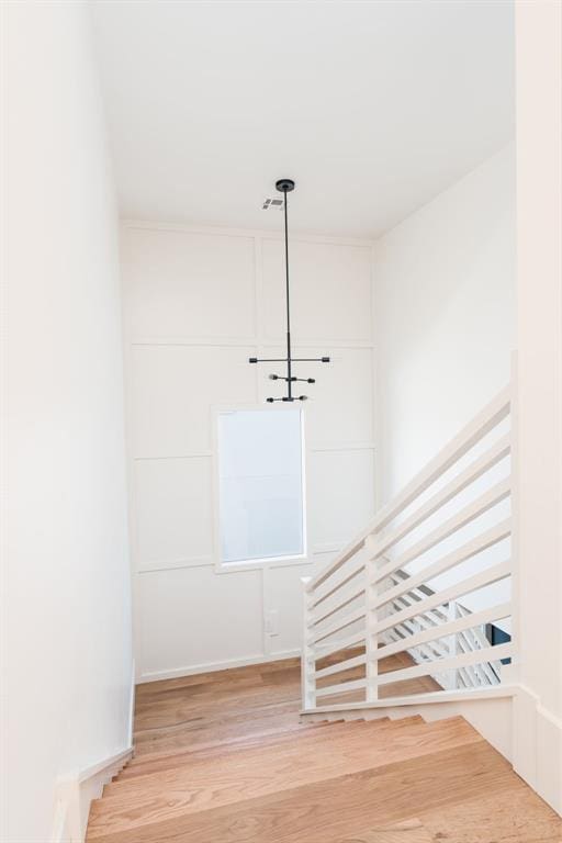 staircase featuring hardwood / wood-style floors